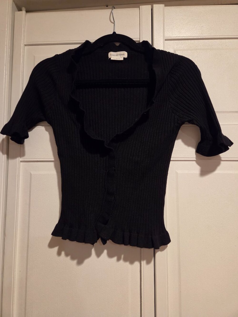 Lovers + Friends One pink and One black of the same ribbed ruffle button blouse